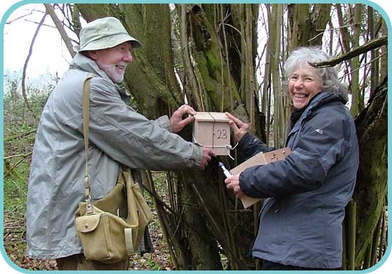 Judith and Peter carefully position a nest box thumb